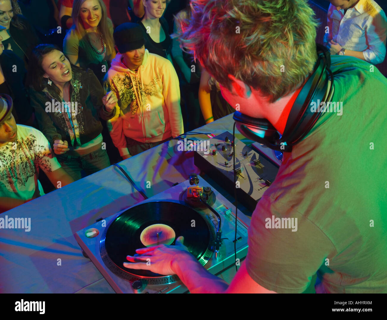 DJ playing in front of crowd Stock Photo