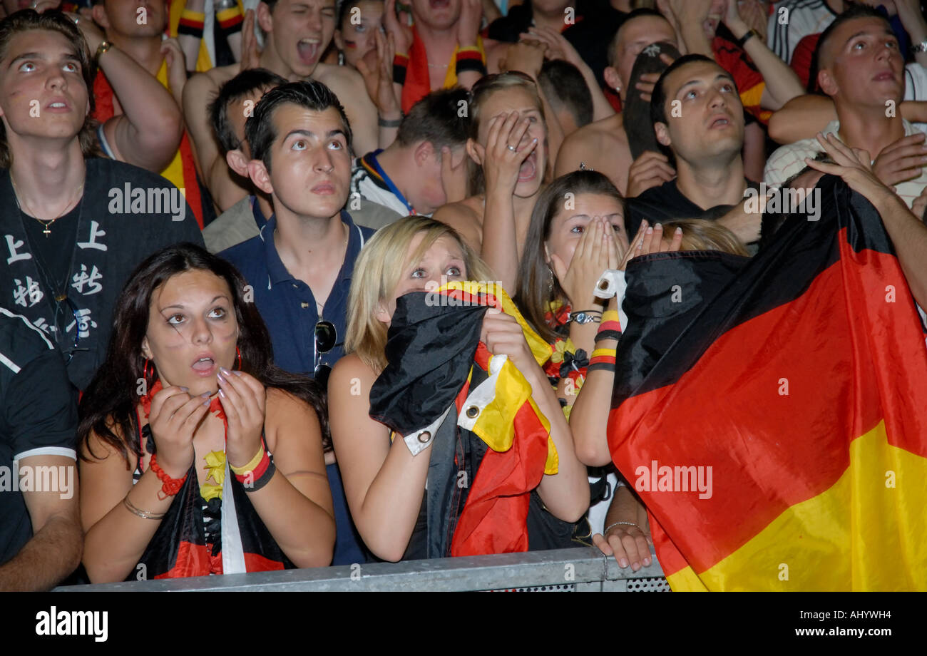 Tense German fans watching football match Stock Photo