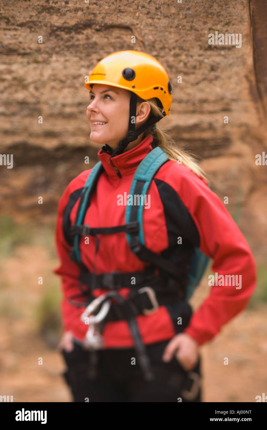 Woman wearing rappelling gear Stock Photo - Alamy