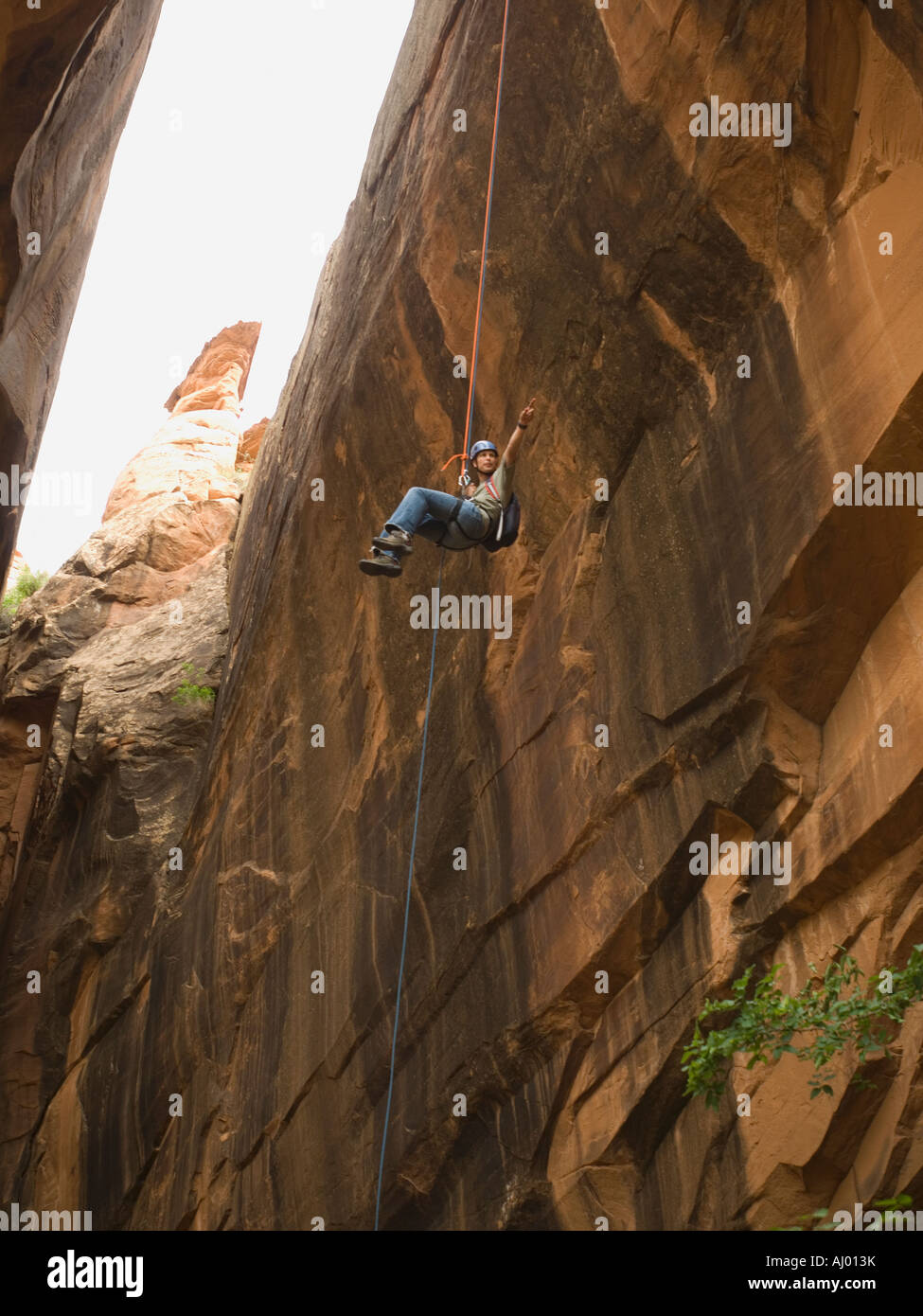 Woman rappelling cliff in hi-res stock photography and images - Alamy