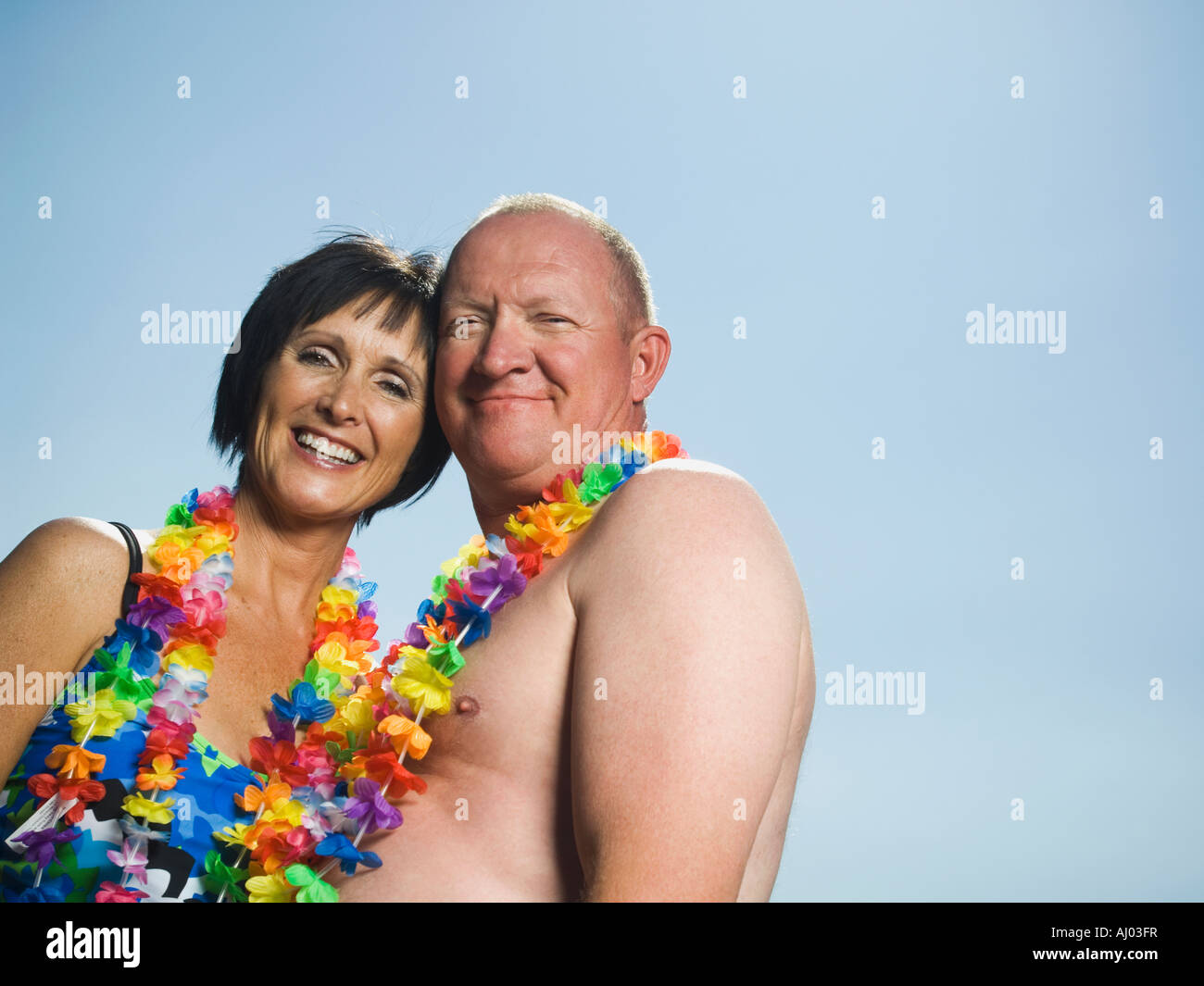 Couple wearing flower leis Stock Photo