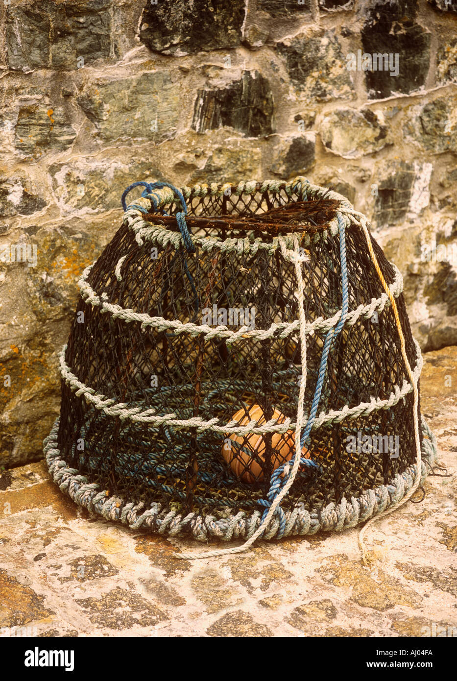 Lobster pot on the harbour at Boscastle in Cornwall in the UK Stock Photo