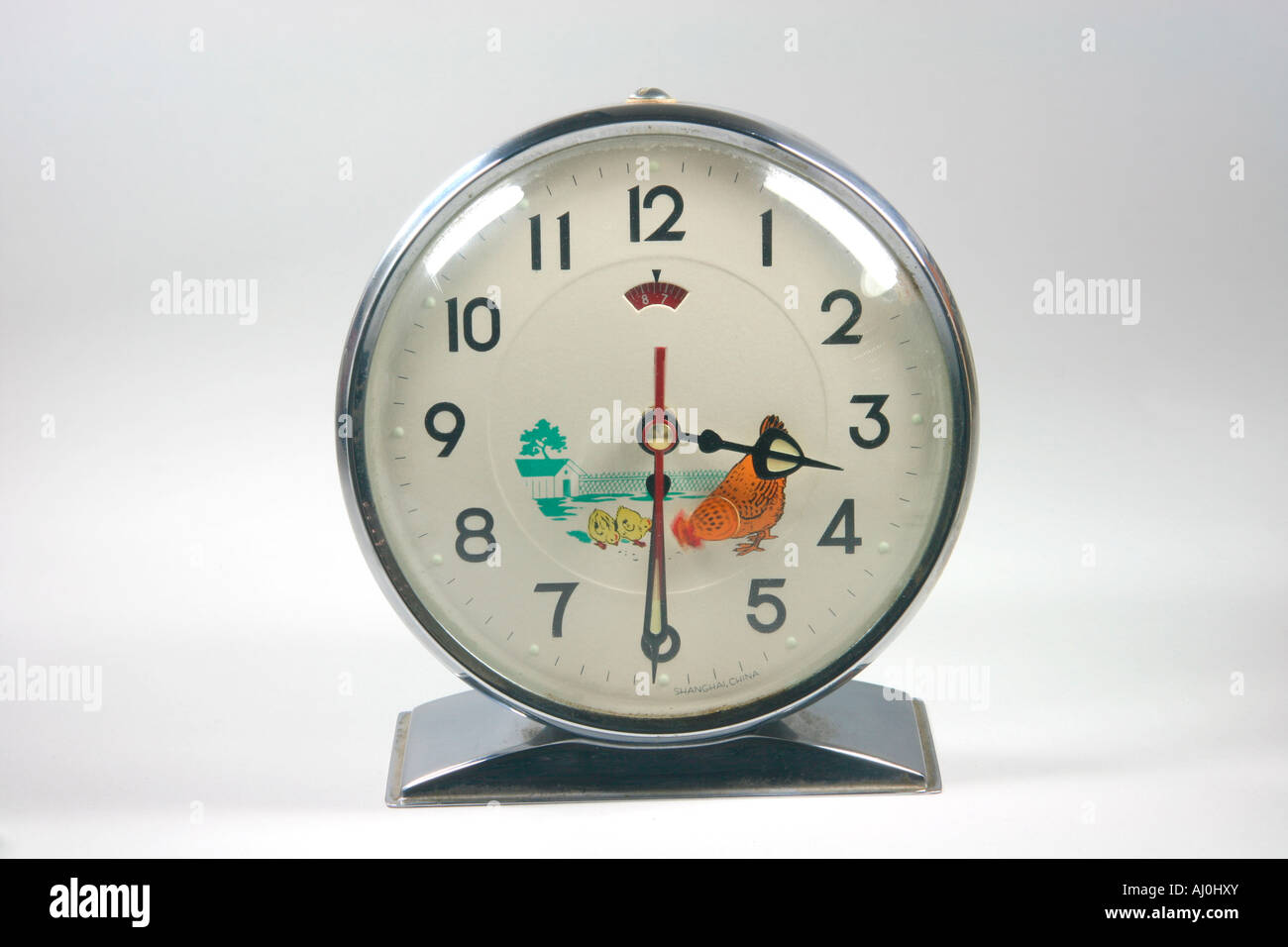 retro alarm clock closeup in white background Stock Photo - Alamy