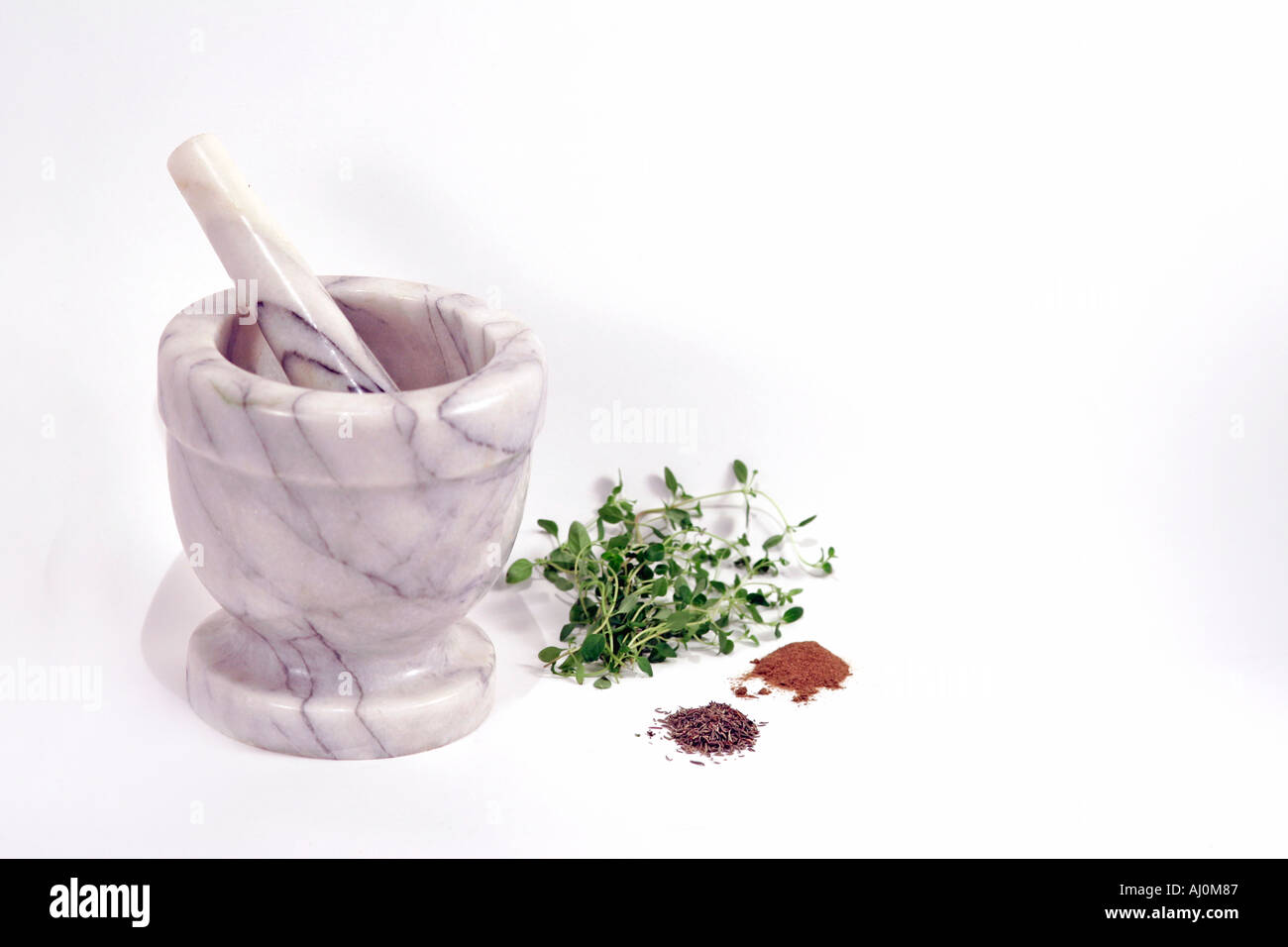 Marble Mortar and Pestle and Thyme Fresh Dried Ground Stock Photo