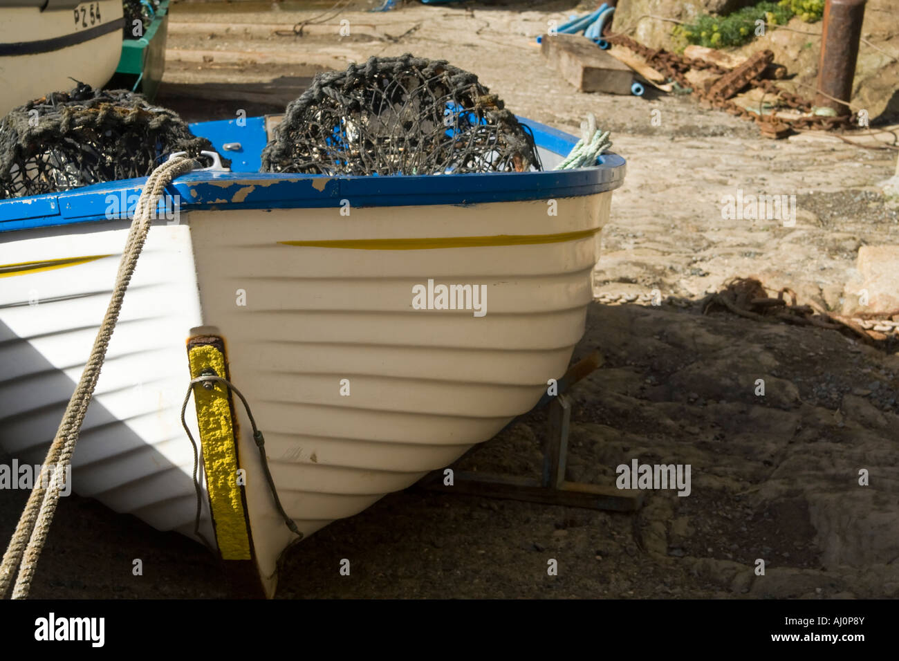 A dinghy on a concrete launching ramp Stock Photo Alamy