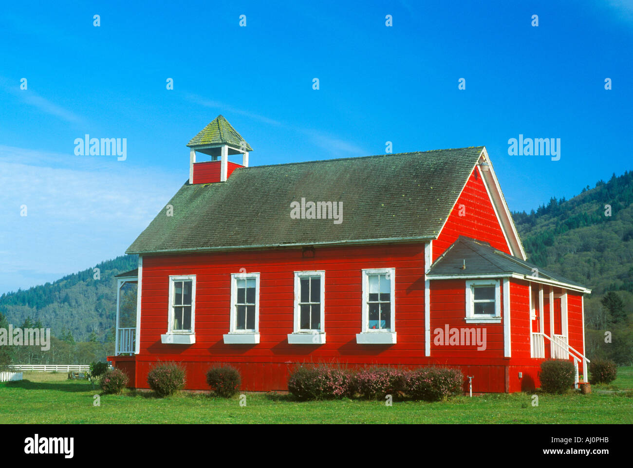 Red one room schoolhouse Stone Lagoon on PCH Northern CA Stock Photo
