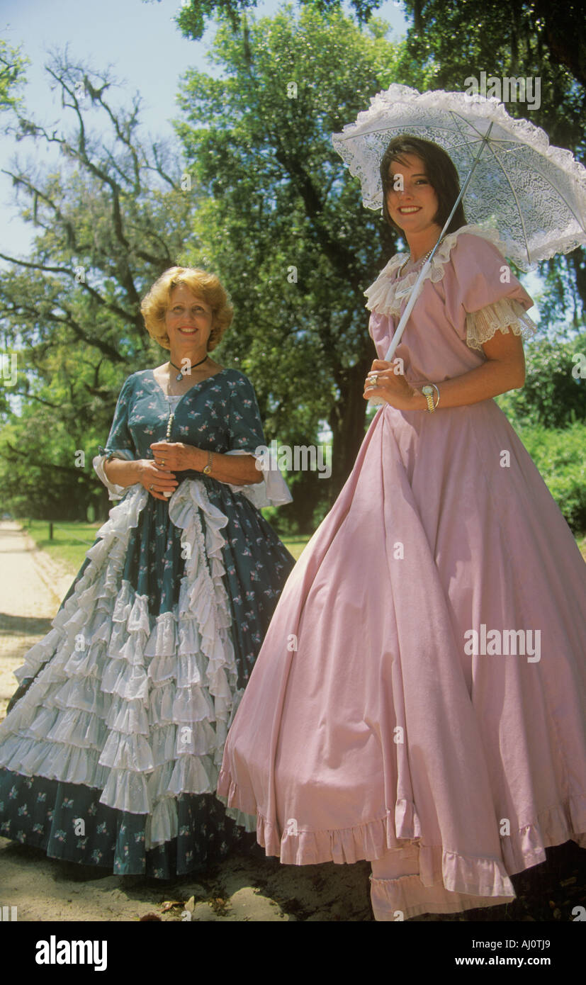 Women dressed in period piece costumes of the Old South Charleston SC Stock Photo