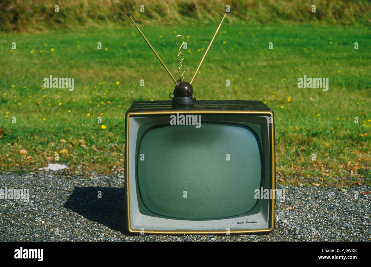 Old retro television set with rabbit ears antennae New England Stock Photo