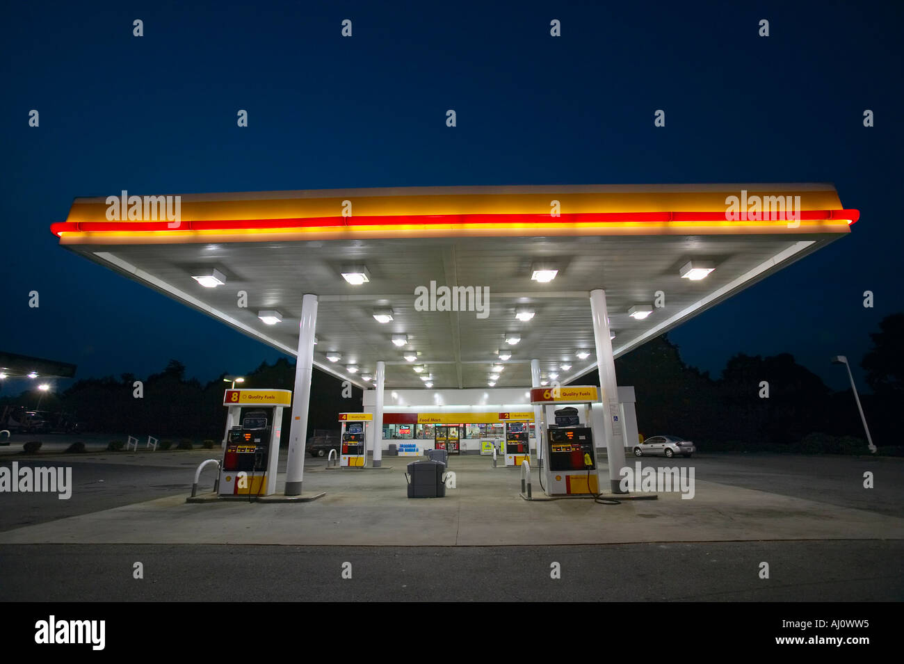 Gas Station with lights on and mini mart at dusk in Central GA Stock