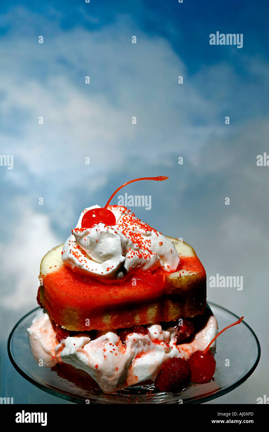 Whip Cream Dessert Topping With Cherry Topper on Jellyrolled Raspberry