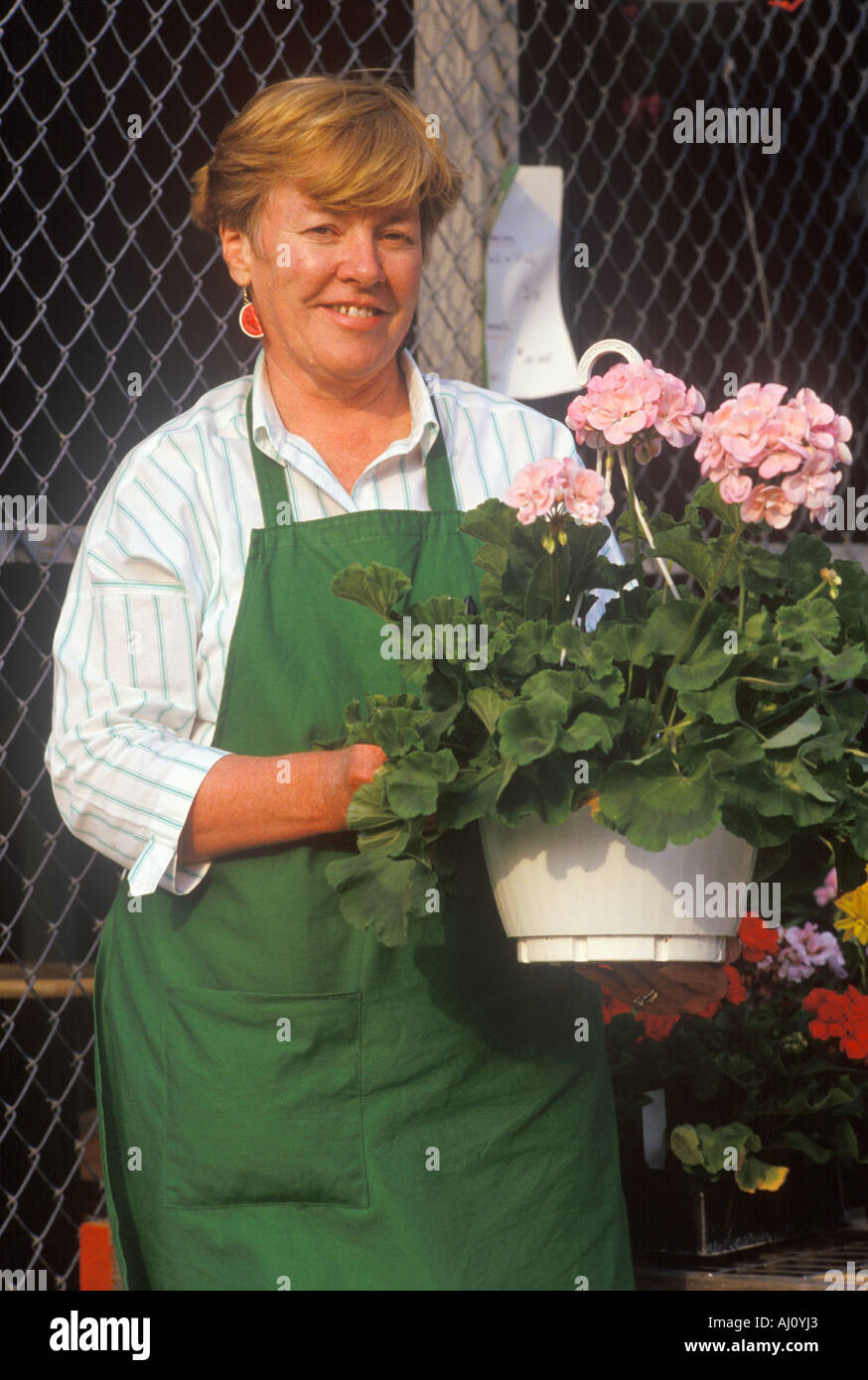 A woman working at a garden center Stock Photo