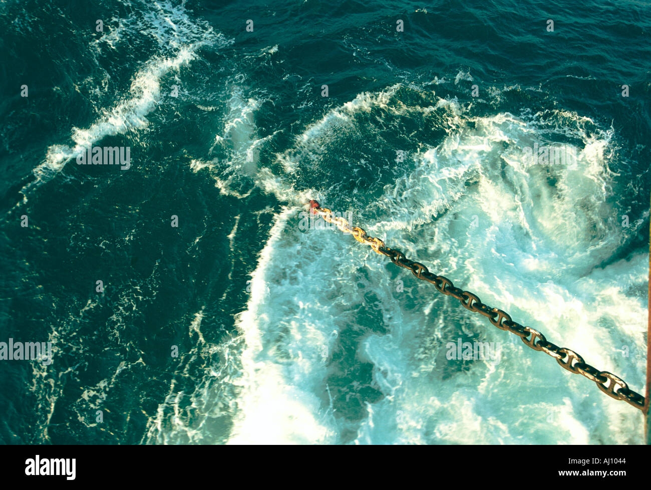 Anchor chain leading though the water Stock Photo Alamy