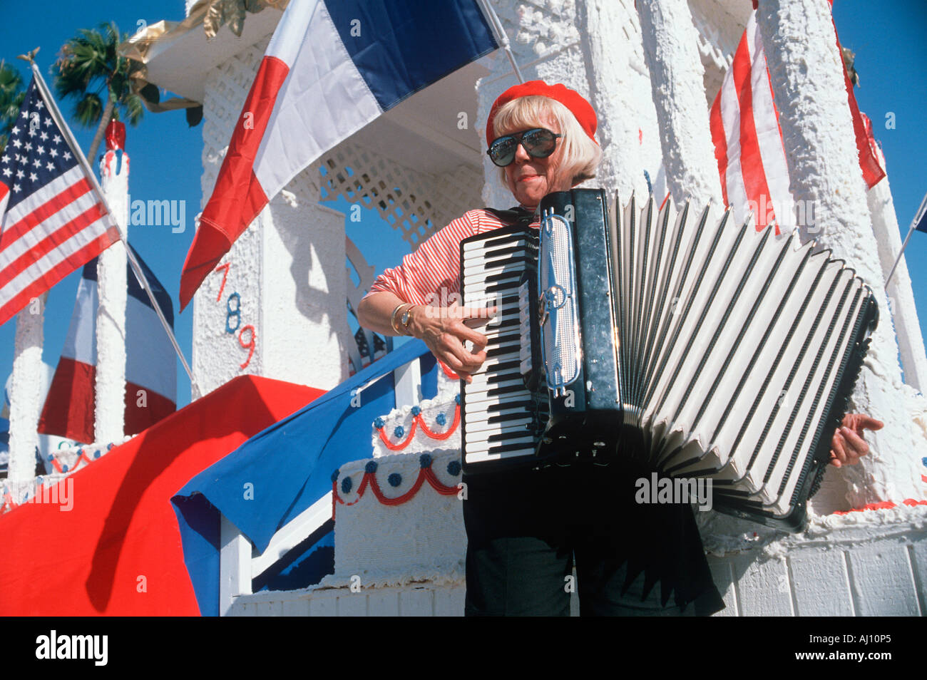 A female accordion player performing at the French Revolution