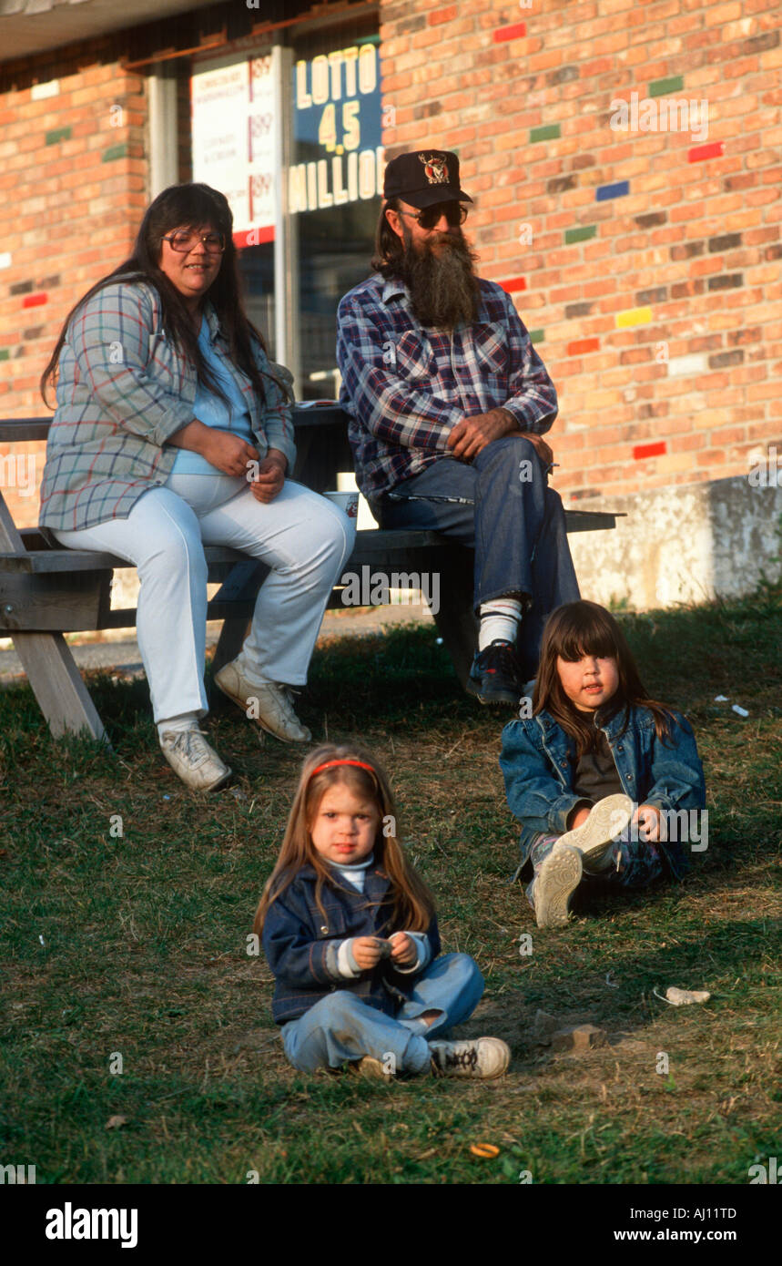 A family of four sitting together in Port Henry NY Stock Photo