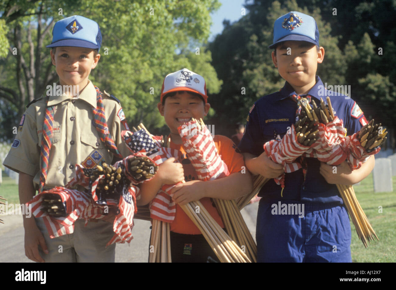 Boy Scouts distributing American flags at on Veterans Cemetery Los Angeles CA Stock Photo