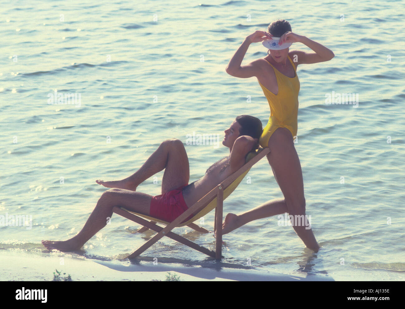 couple relaxing on beach Stock Photo