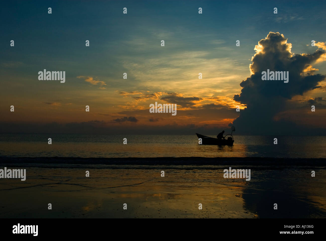 Silhouette of a fisherman Stock Photo - Alamy