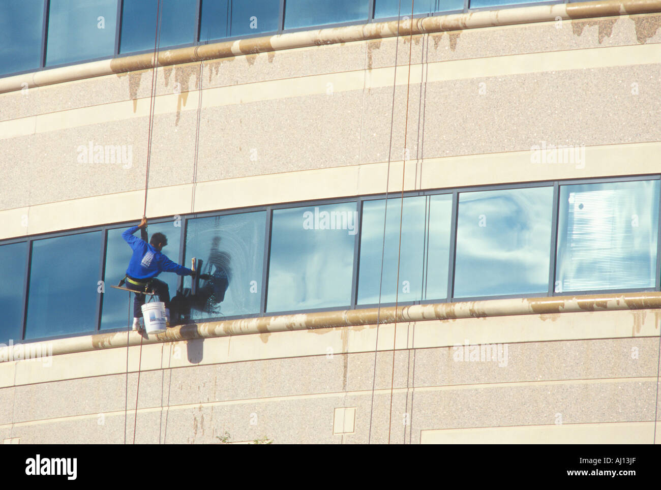 Window washer on a high rise building Stock Photo Alamy