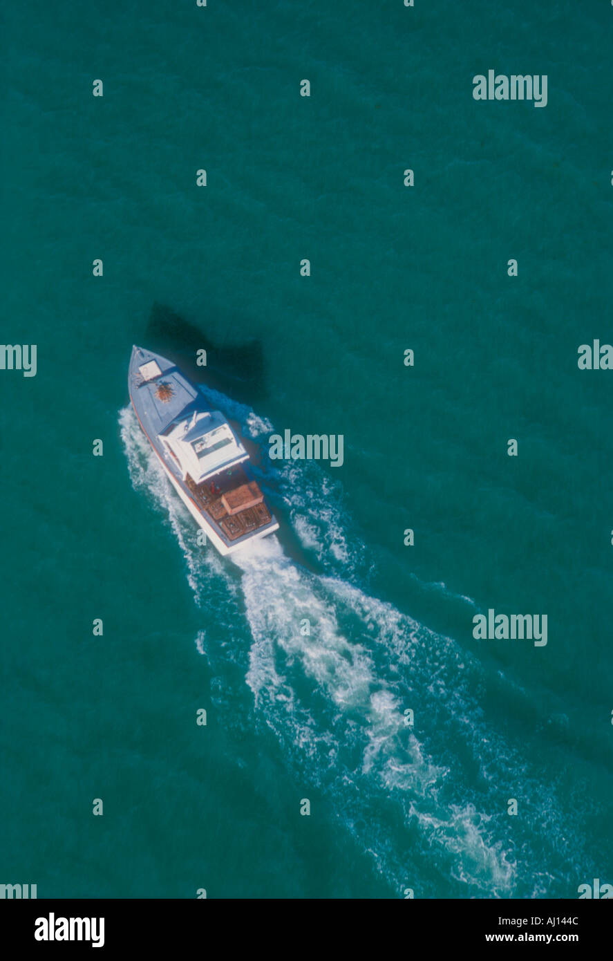 aerial view of motor yacht moving in Caribbean waters Stock Photo