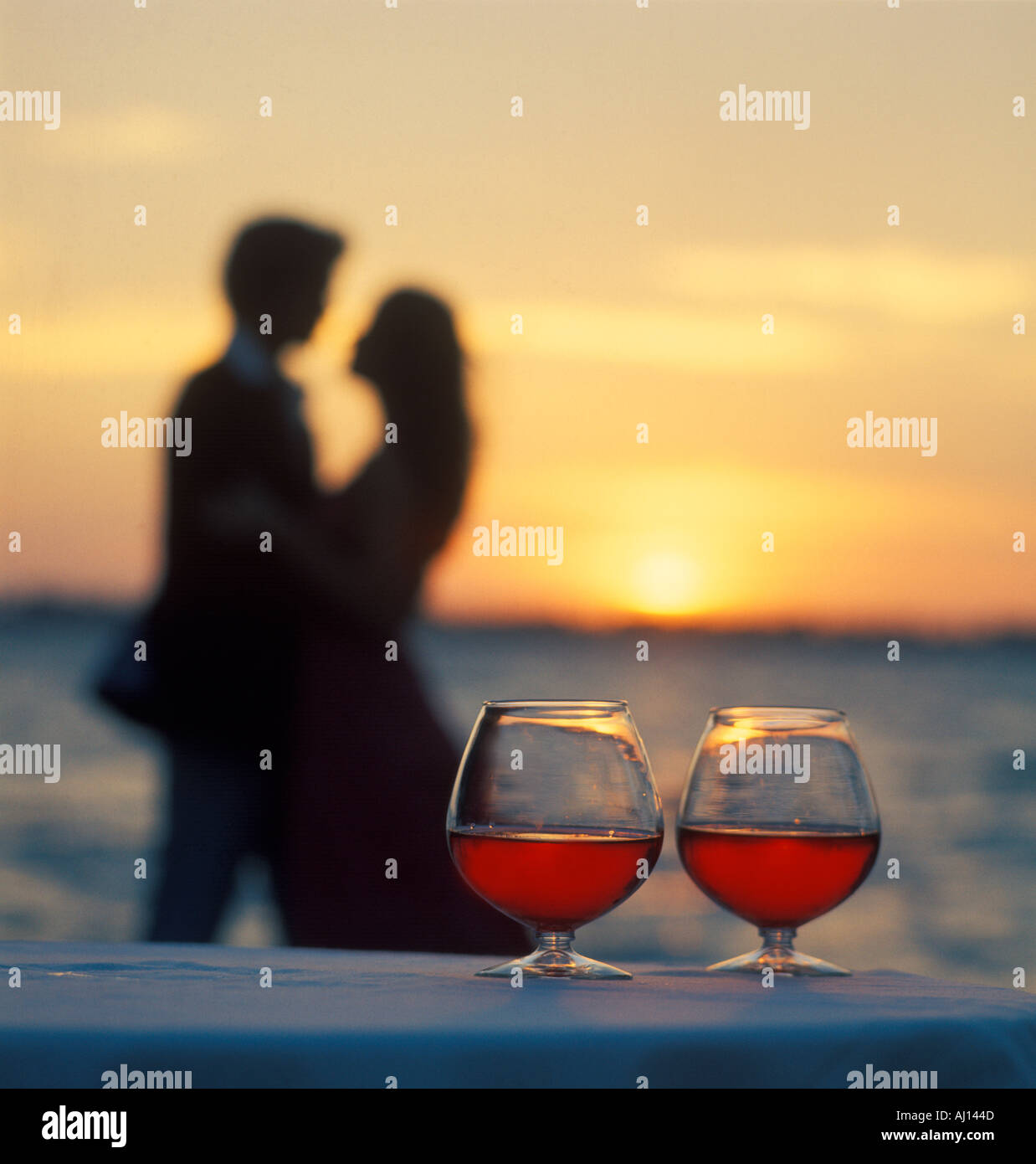 Silhouette couple drinking wine sunset hi-res stock photography and ...