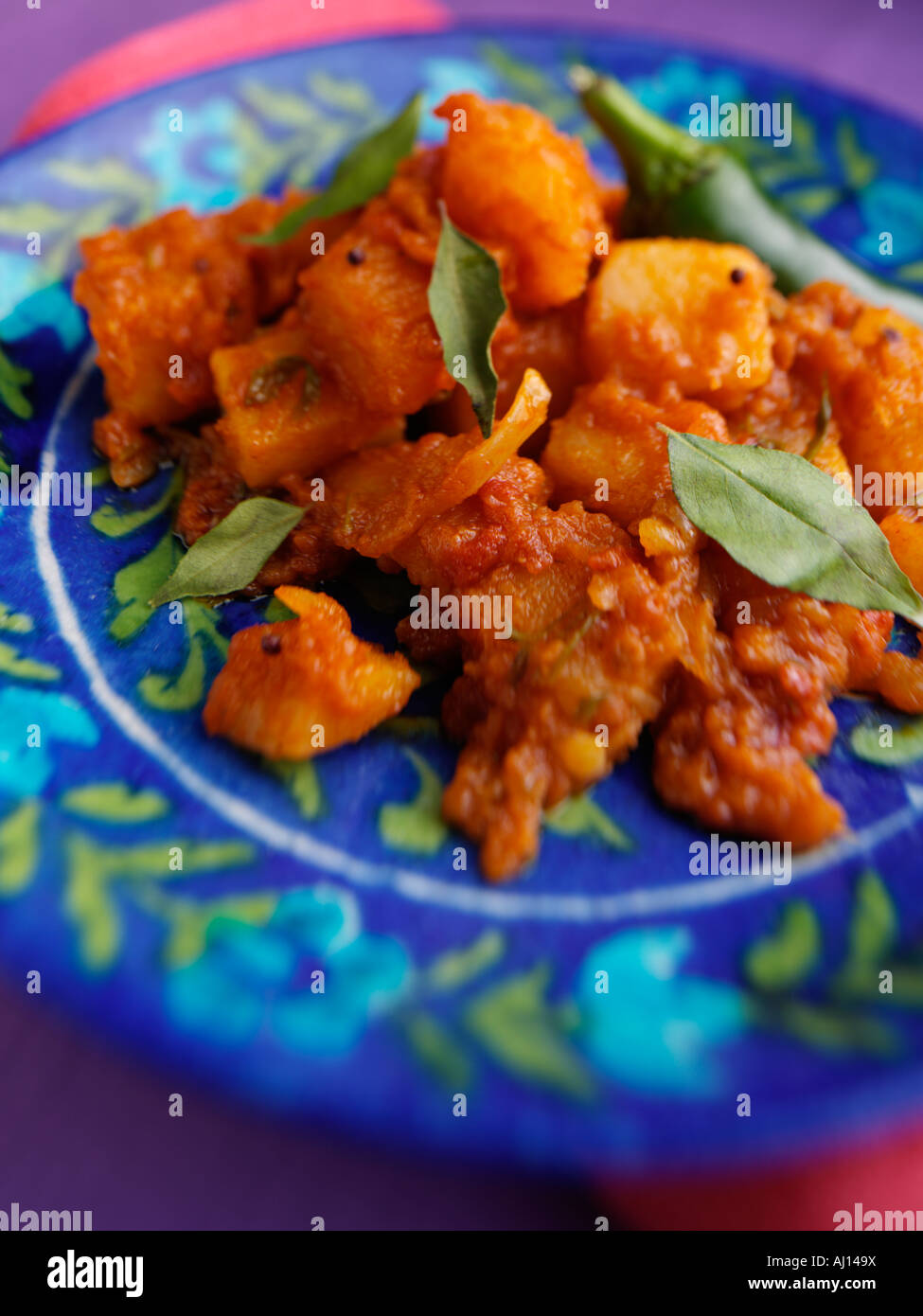 Indian curried Bombay potatoes vegetarian meal Stock Photo