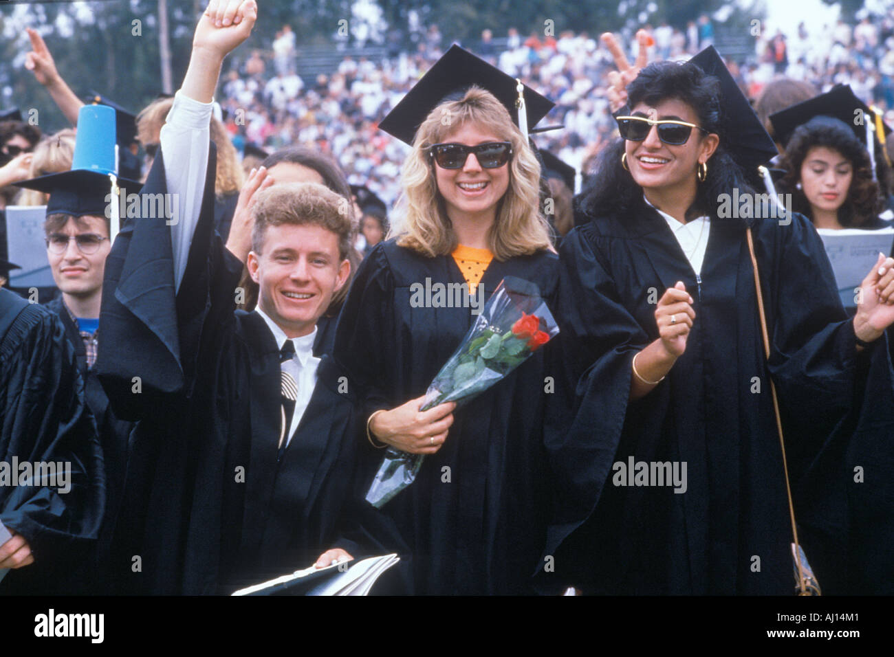 Asian American coeds smiling during their ceremony UCLA Los Angeles CA Stock Photo
