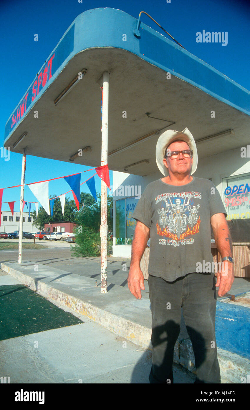 A man standing outside an abandoned gas station Waco TX Stock Photo Alamy