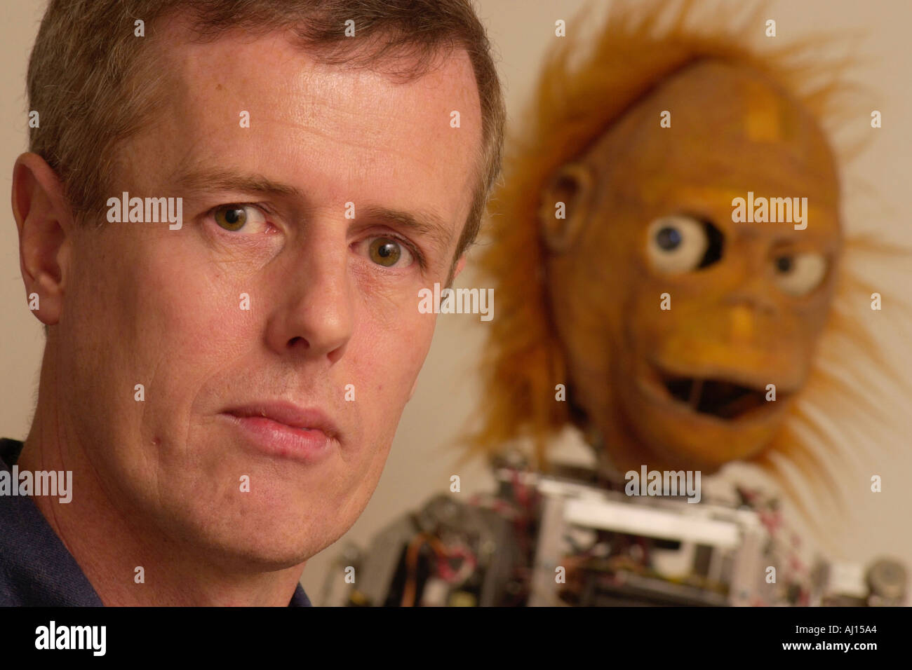 Self taught scientist Steve Grand of Cyberlife Research with Lucy the intelligent android he has built Stock Photo