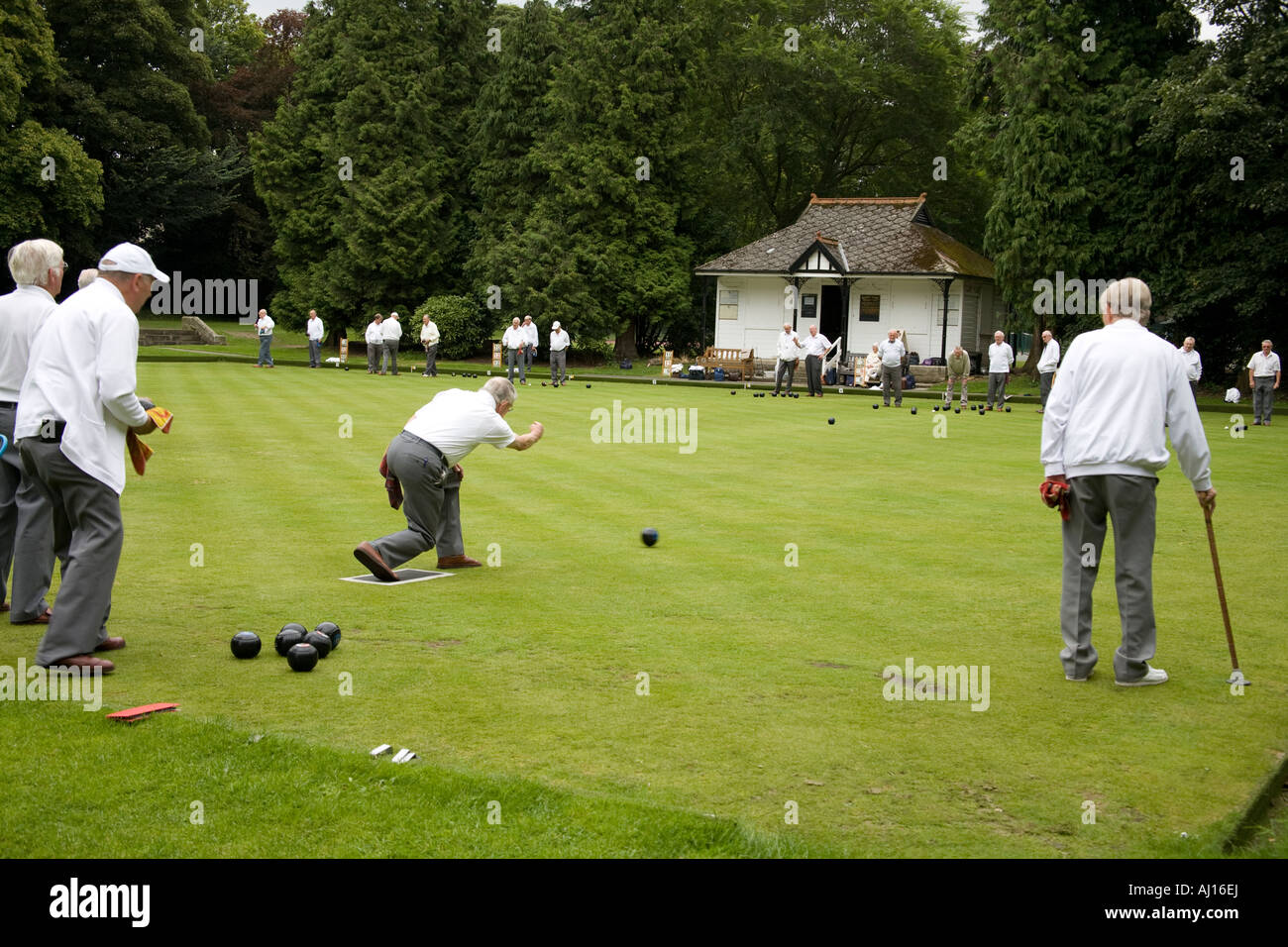 Men playing bowls on a bowling green, Bowes Museum, Barnard Castle, County Durham, England Stock Photo