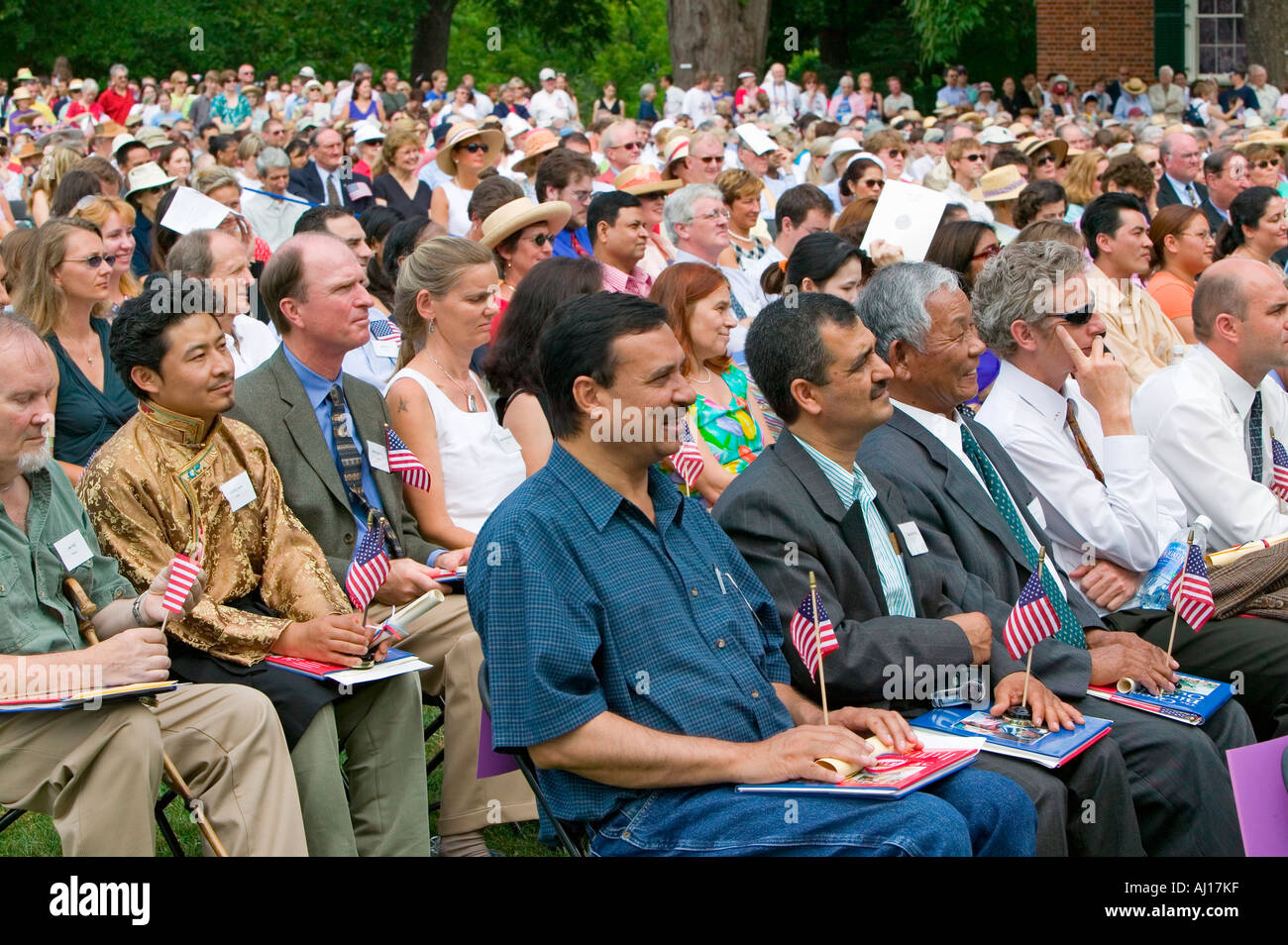 Iraq immigrant applauding with 76 new American citizens at Independence Day Naturalization Ceremony on July 4 2005 at Thomas Stock Photo