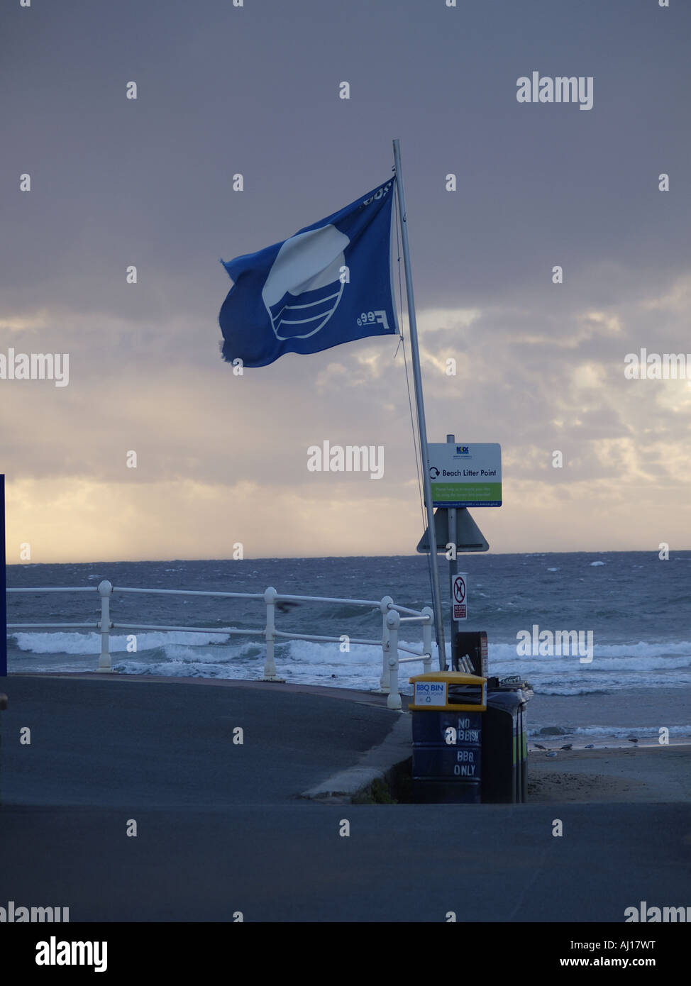Prestigious Blue Flag , flying beside the beach Stock Photo