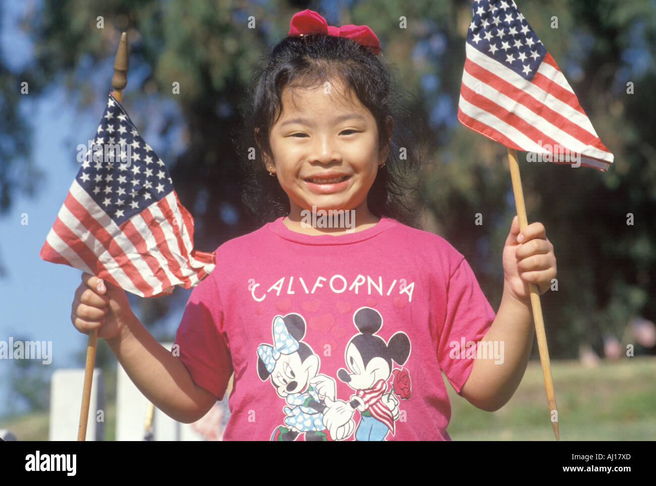 Asian girl holding american flags hi-res stock photography and images ...