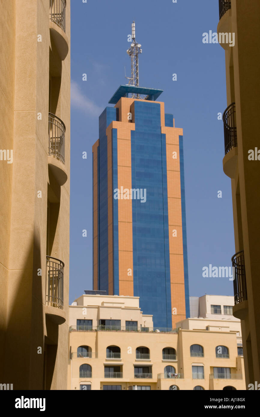 View of Portomaso Tower through apartment buildings near the Hilton Hotel in Malta. Stock Photo