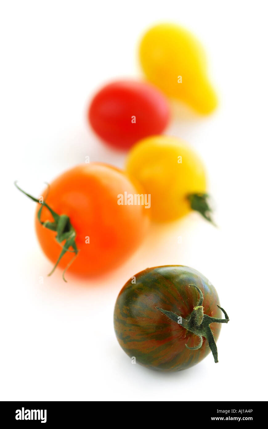 Multicolored cherry tomatoes isolated on white background Stock Photo ...