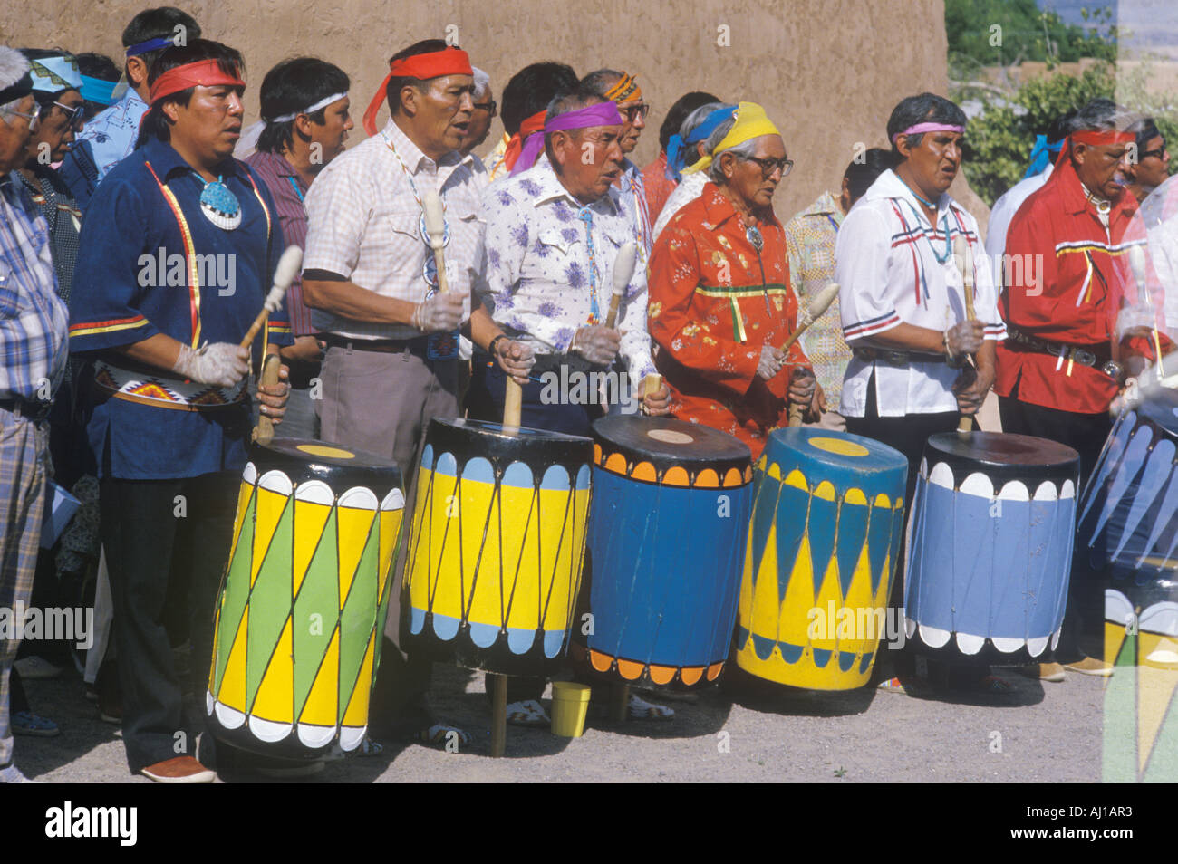 Native American elders drumming during Corn Dance ceremony in Santa