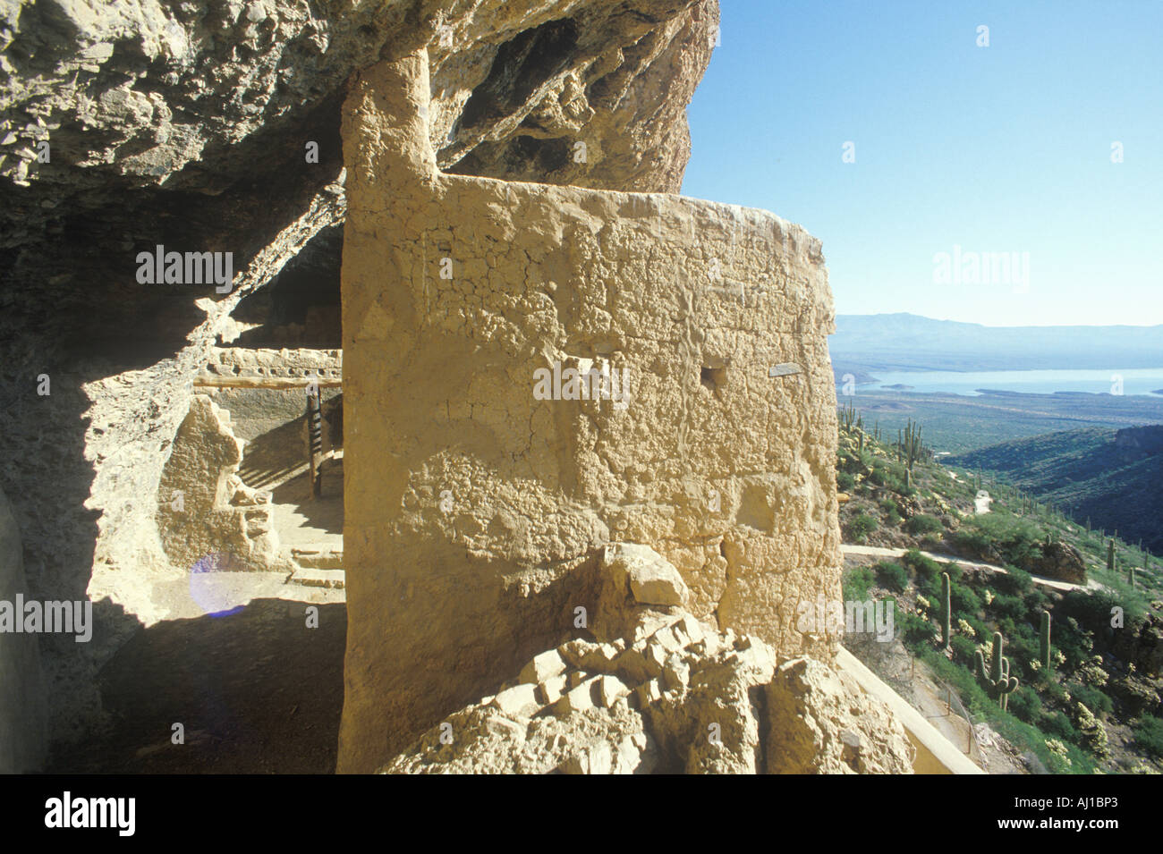 Cliff dwellings circa 1400 AD and Roosevelt Lake Tonto National Monument AZ Stock Photo