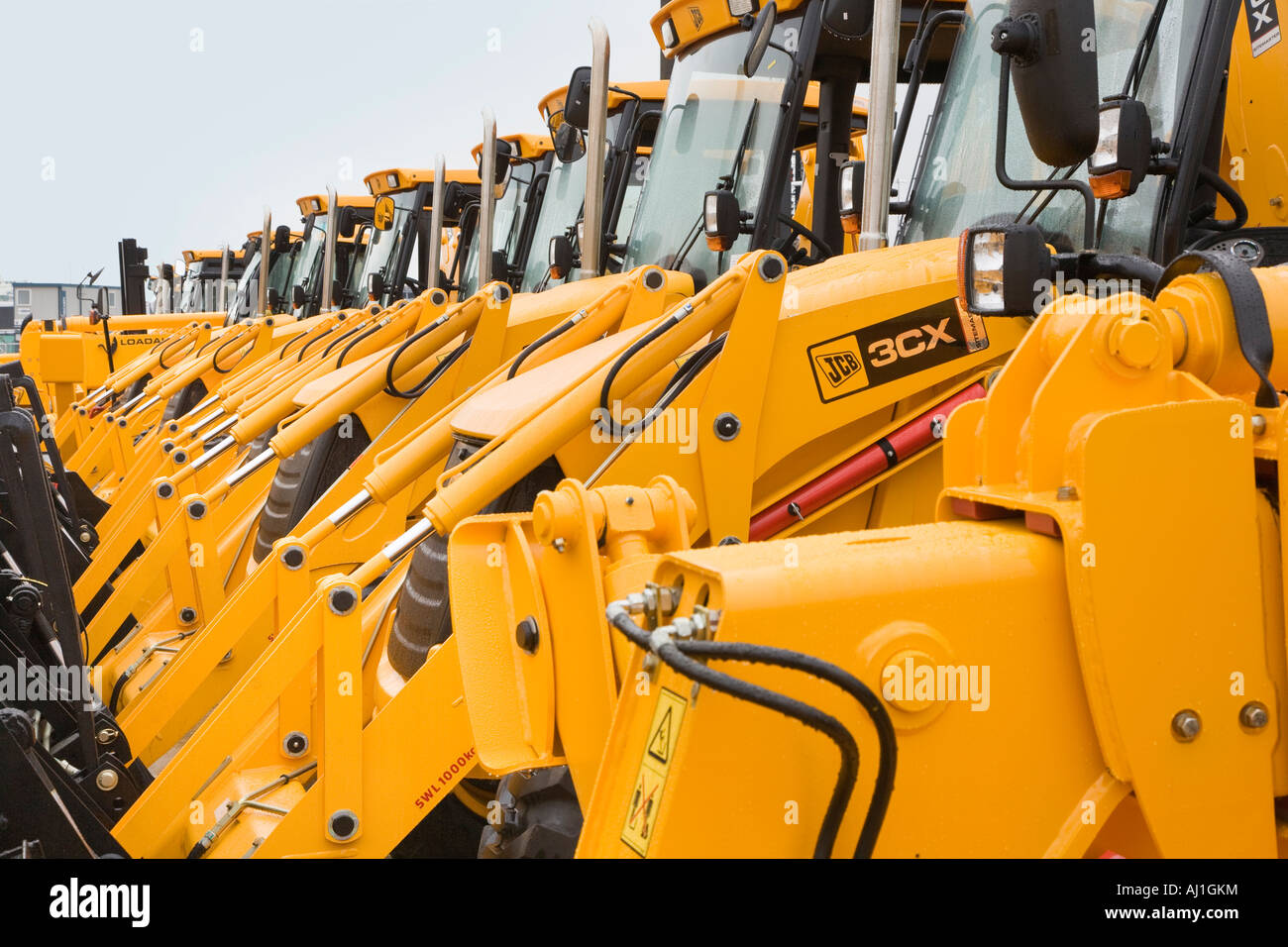 Line of JCB diggers ready for export at Southampton Docks Stock Photo