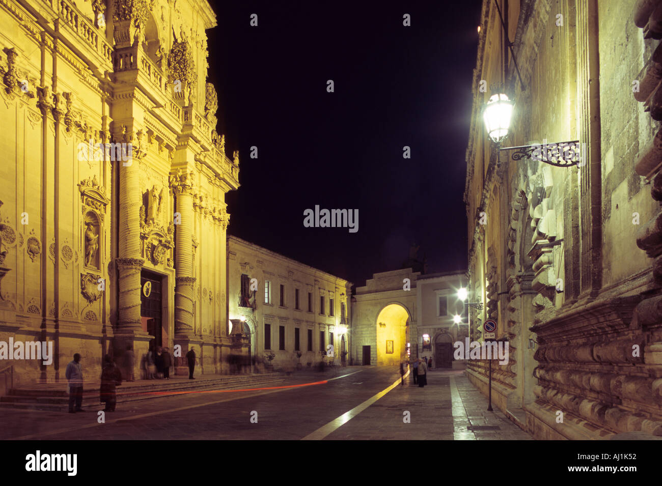 Libertini street with Church of the Rosario on the left and Porta Rudiae at the bottom Lecce Puglia Italy Stock Photo