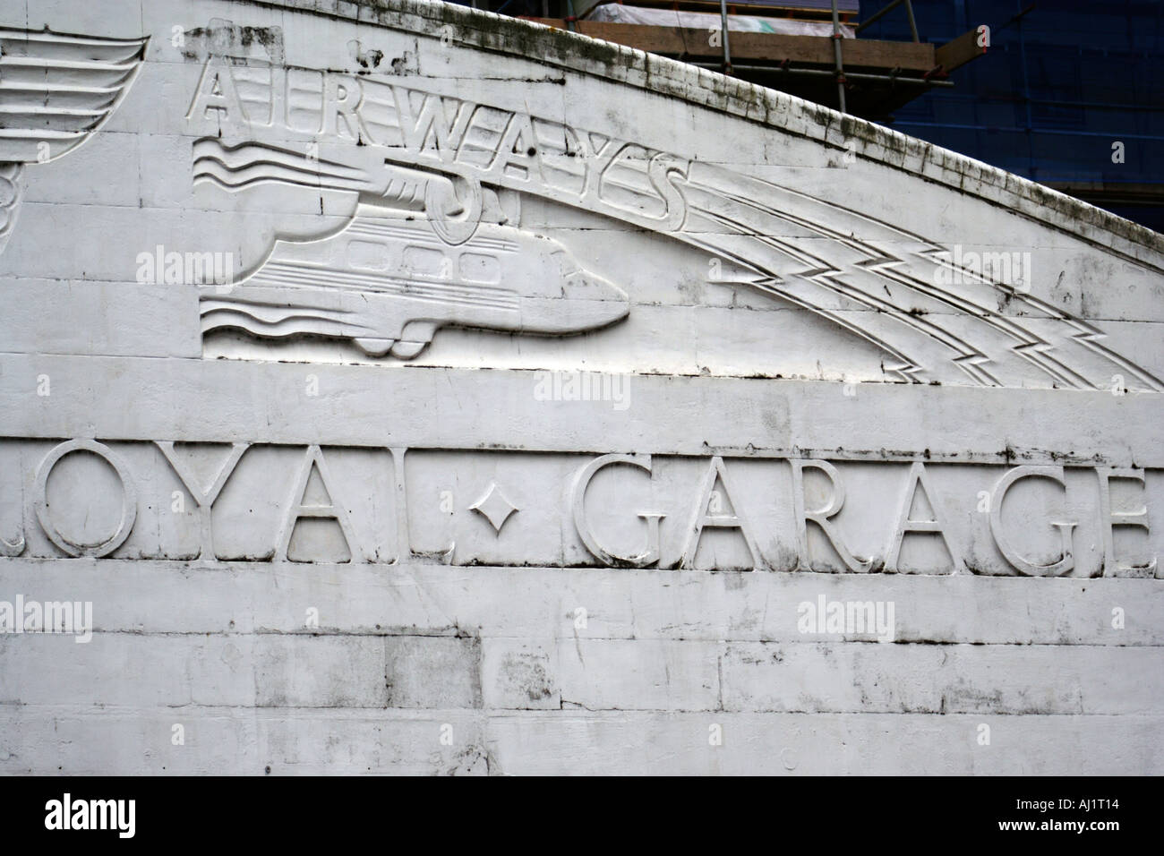 Historic facade depicting the golden age of transport on a garage on Westgate Cardiff Wales Great Britain Stock Photo