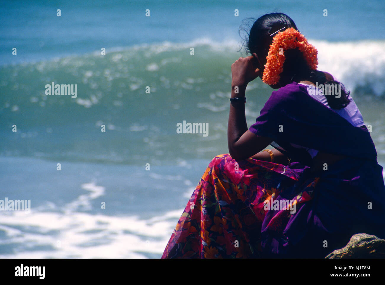 Woman watching waves hi-res stock photography and images - Alamy