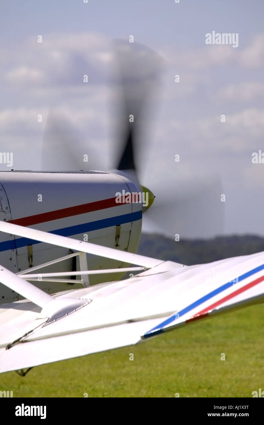 The propeller on a white red and blue aircraft Stock Photo