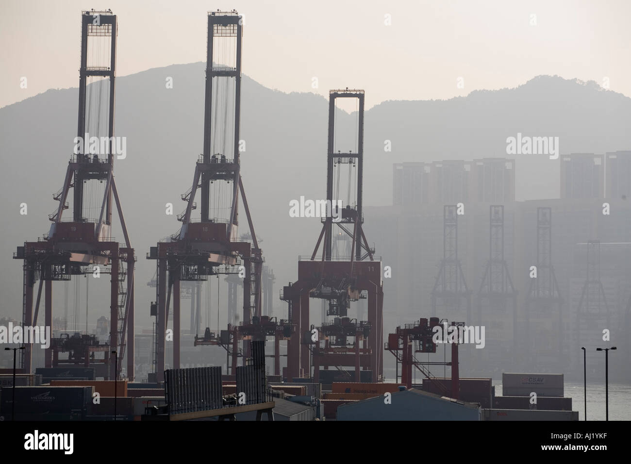 Asia Peoples Republic of China Hong Kong Silhouette of cargo cranes at ...
