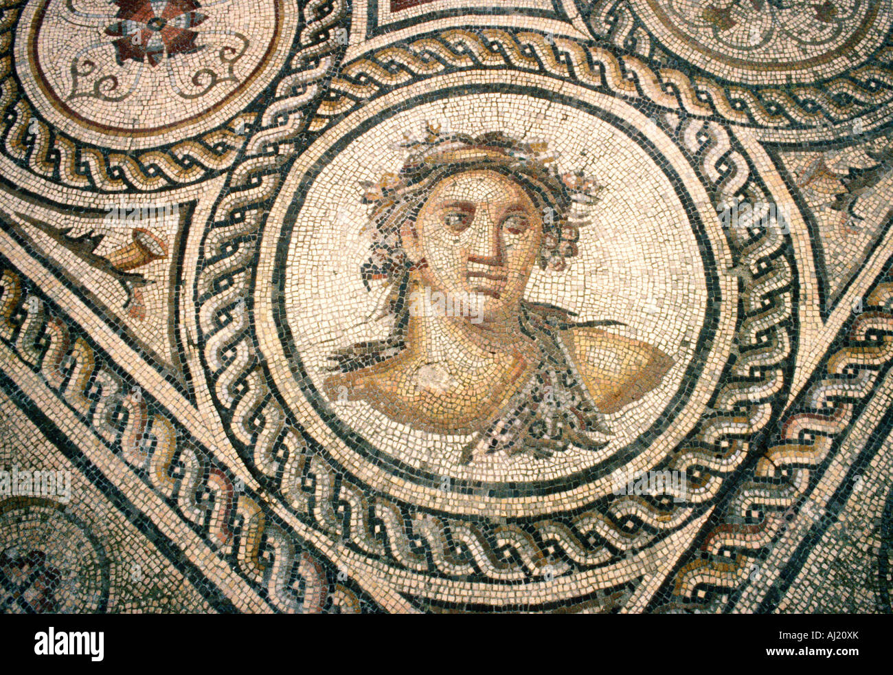 detail roman mosaic depicting male head Stock Photo
