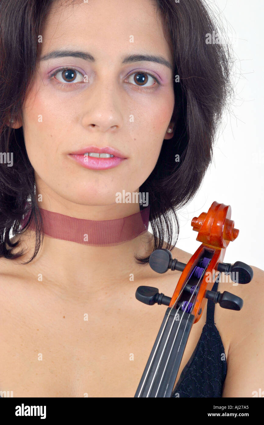 Headshot of young woman in black evening gown holding a violin Stock Photo