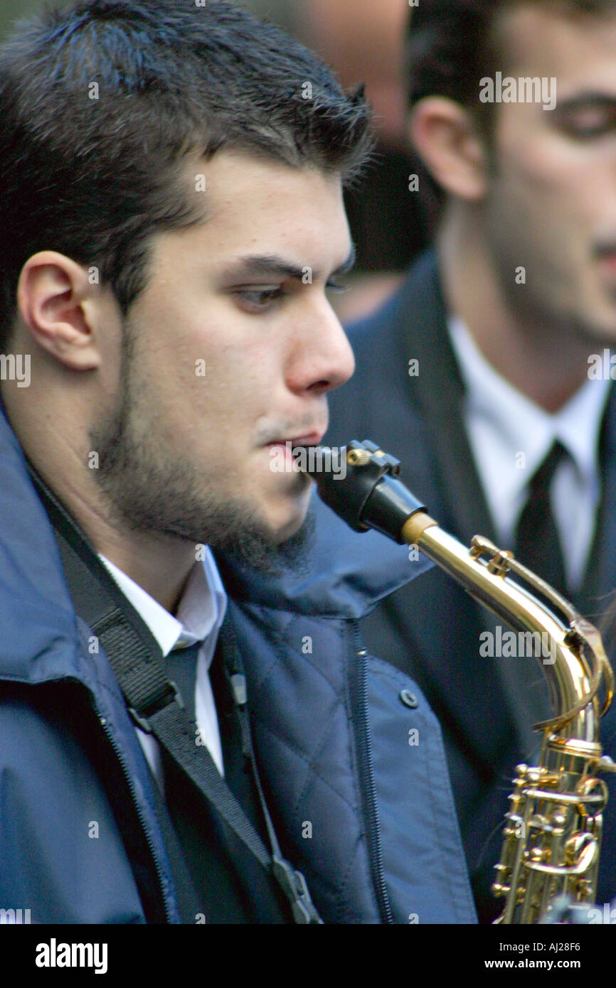 Boy playing a saxophone hi-res stock photography and images - Alamy