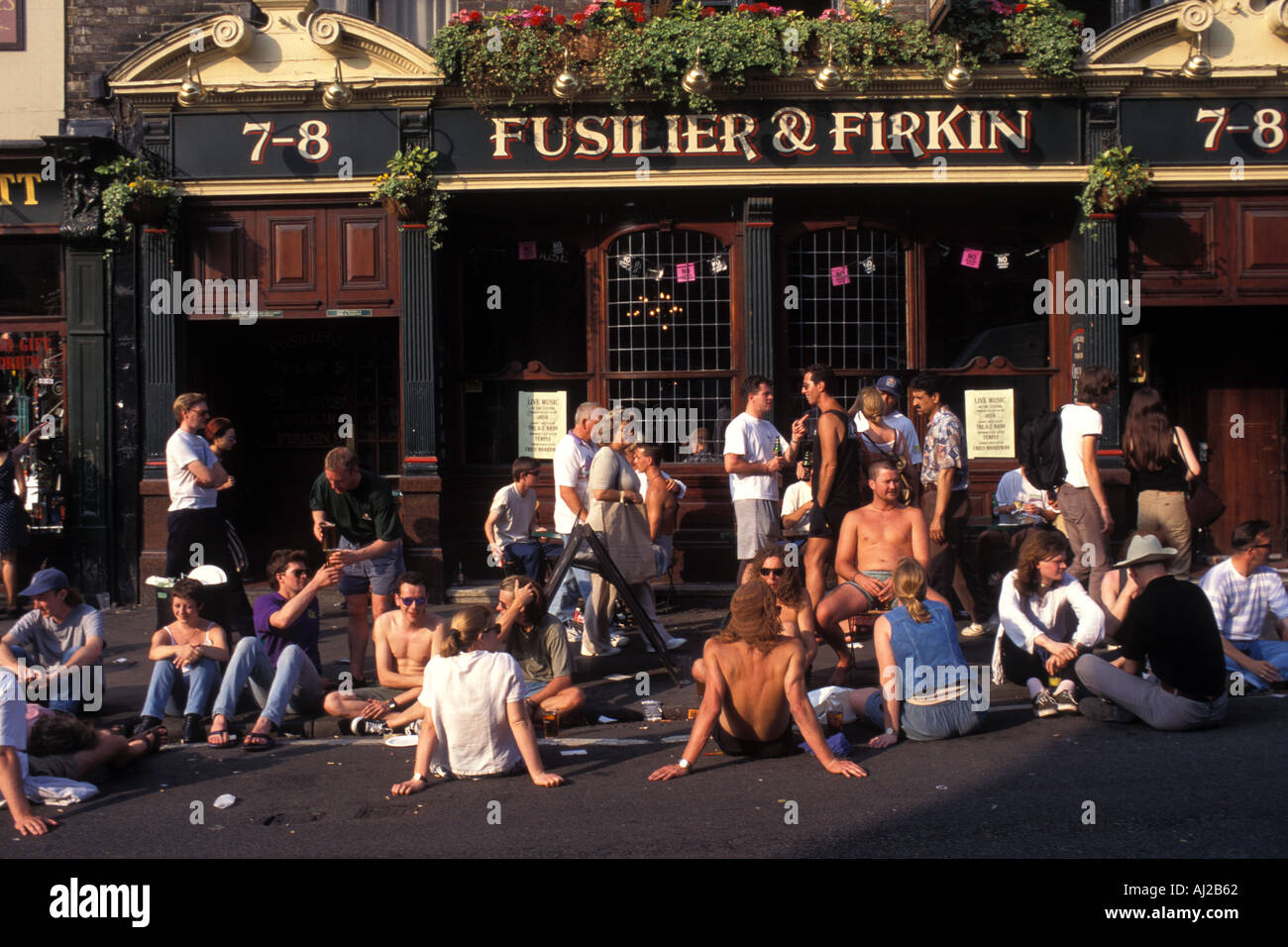 People drinking outside pub in Camden Town London England UK Stock Photo
