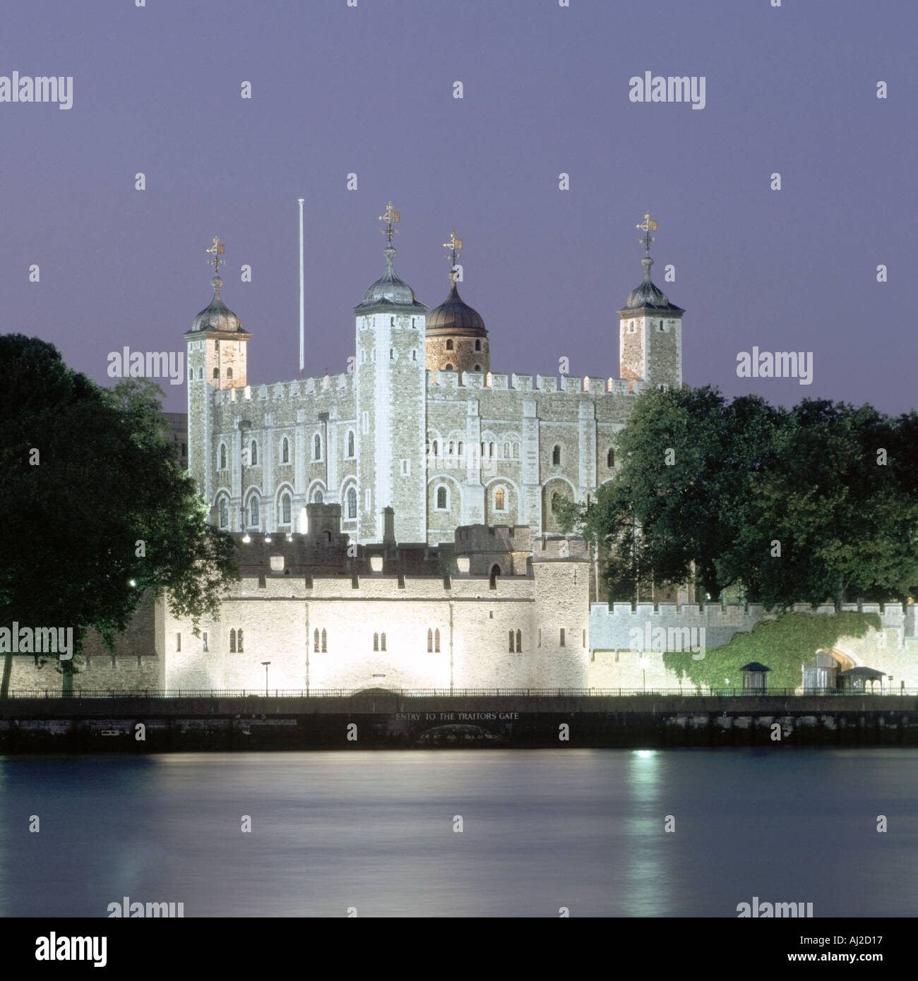 The Tower of London dusk floodlighting and reflections in the River Thames Stock Photo