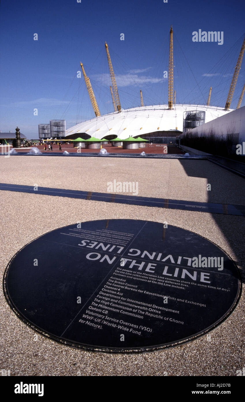 Greenwich meridian line at its location in millennium dome year 2000 exhibition plaque linking to Living Lines theme North Greenwich London England UK Stock Photo