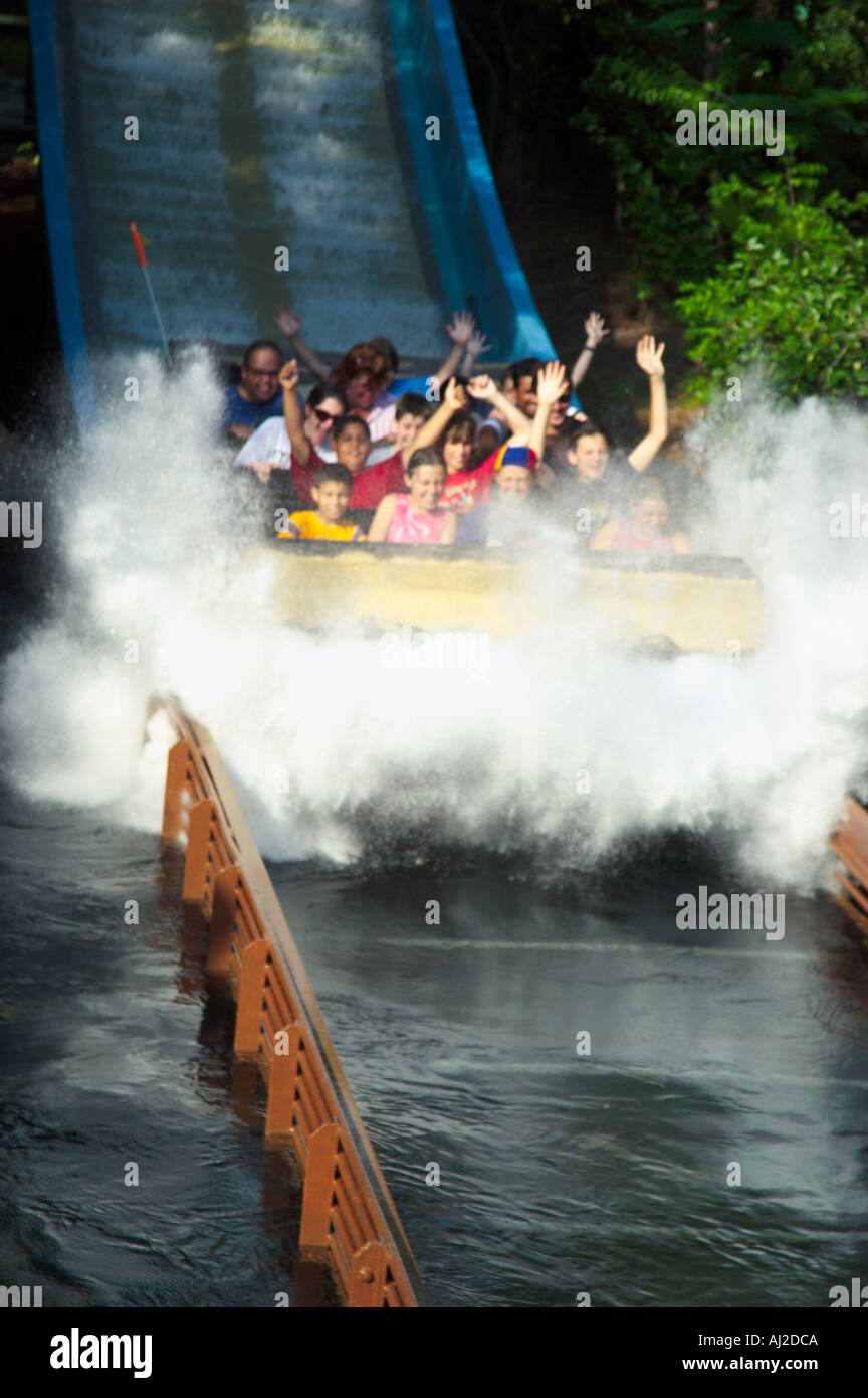 Amusement park visitors splashing down in water ride Stock Photo Alamy