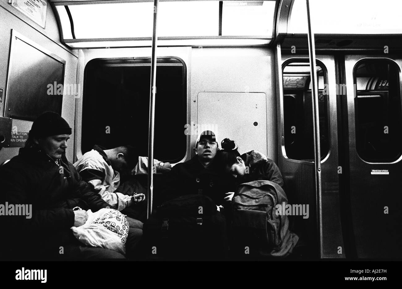 Commuters asleep on Chicago s El in 2000 Stock Photo